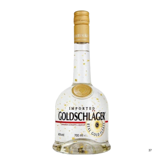 A bottle of Goldschlager Real Gold Classic spirit liqueur, 700 ml, featuring a clear glass bottle with gold glitter, a gold cap, and a white label with black and gold lettering.